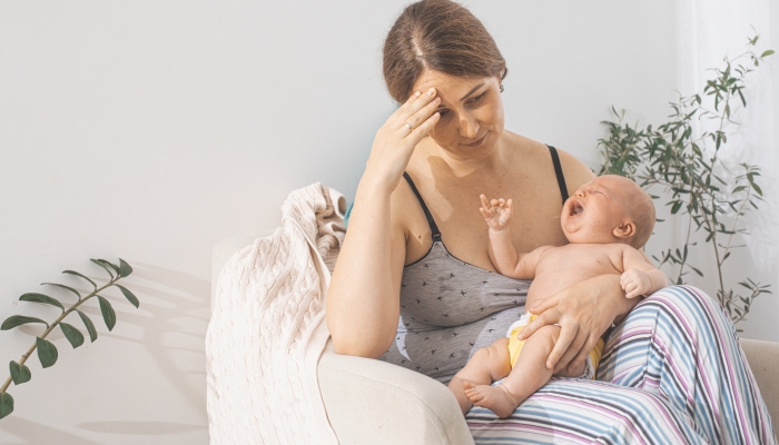 The young mom wants to breastfeed her newborn baby.