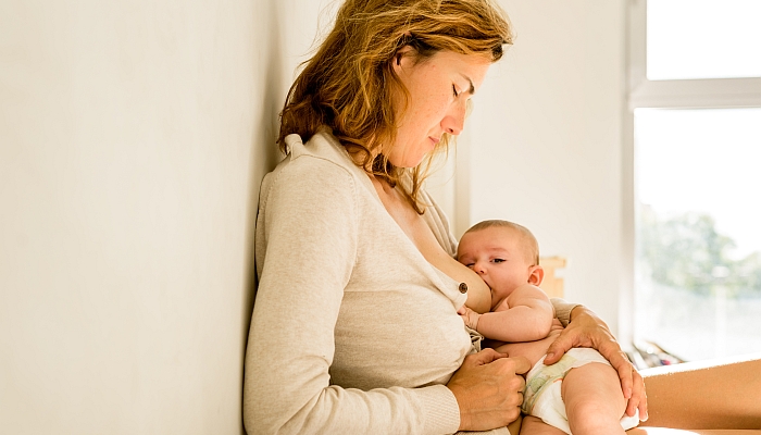 Baby breastfed for breast milk, alternative maternity concept.