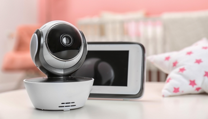 Baby monitors on table in room.