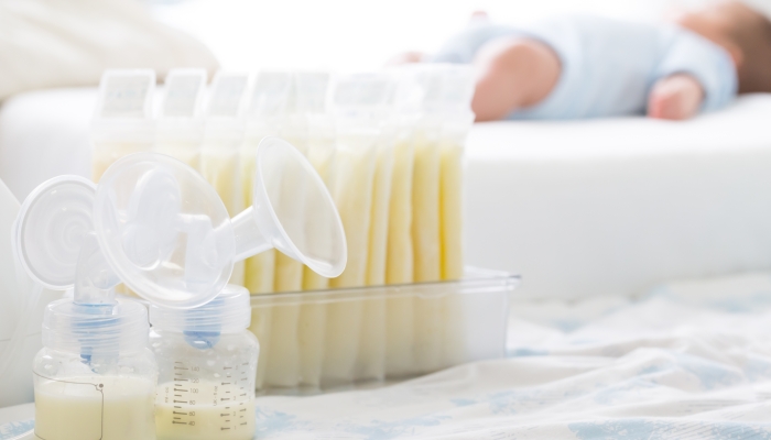 Breast milk frozen in storage bag and baby.