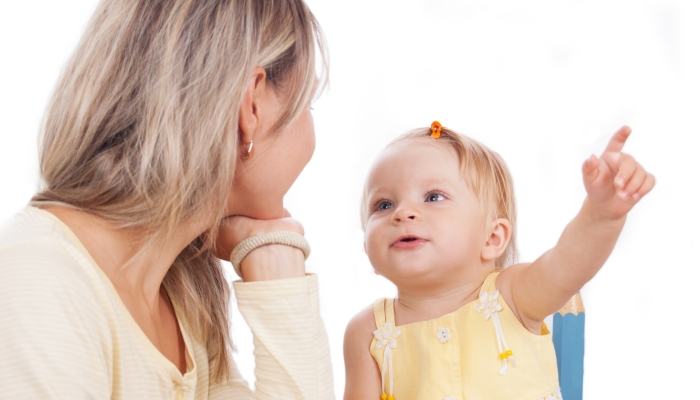 Mother and little daughter talking.