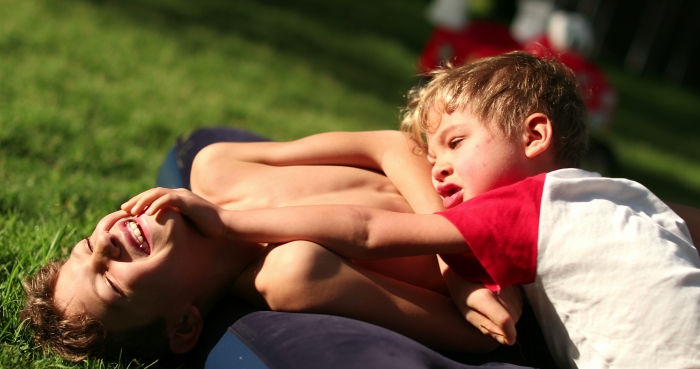 Playing rough with his brother.