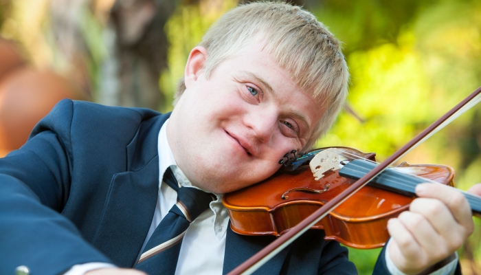 Portrait of young handicapped violinist.