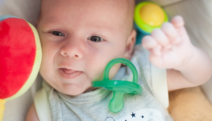 Baby boy doesn't like to use his pacifier.