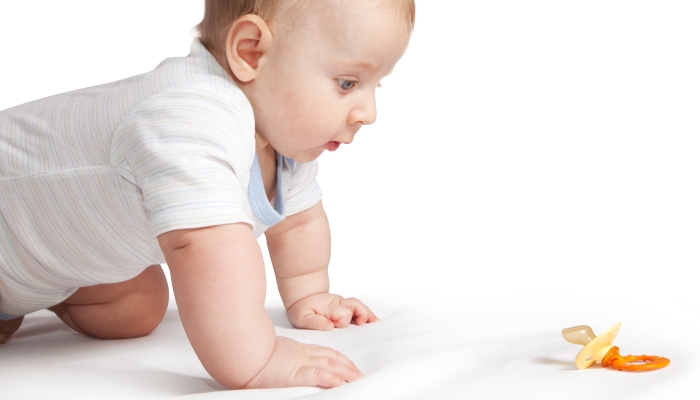 Child looking the pacifier.