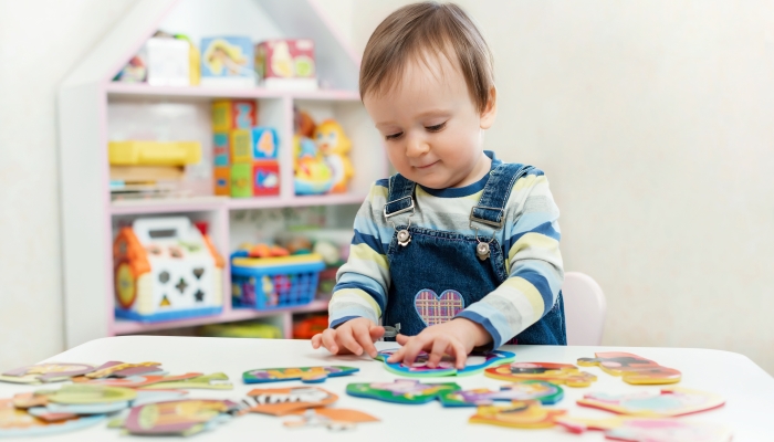 Child doing puzzle.