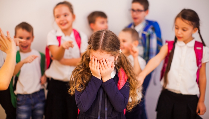 The girl suffers from bullying by peers at school.