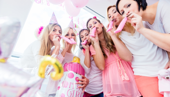 Group of women on baby shower party having fun.