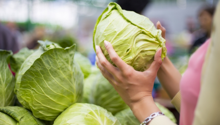 Woman buying vegetables.