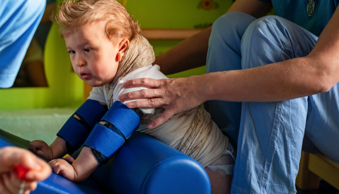 Young boy at physical therapy.