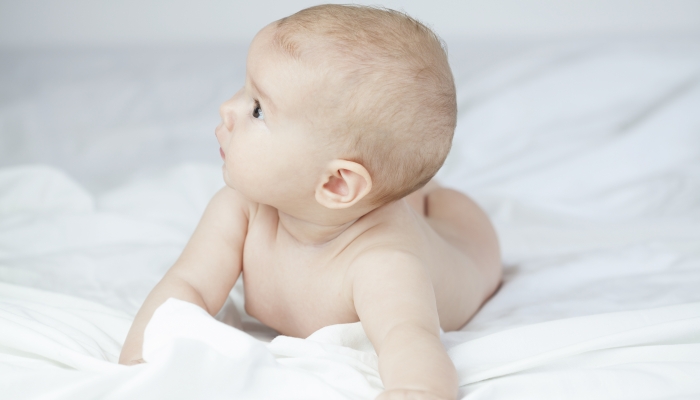 Curious baby turning head to side to side.