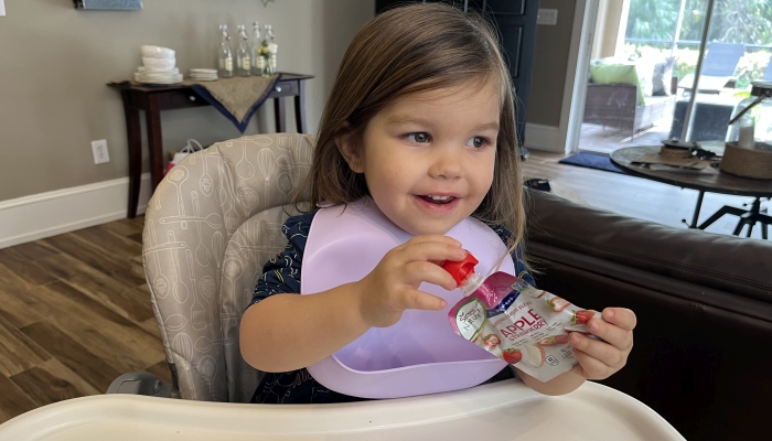 Cute little girl with baby bib.