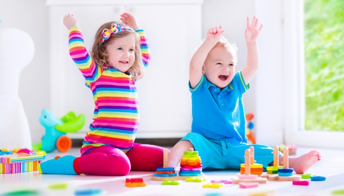 Kids playing with wooden blocks.