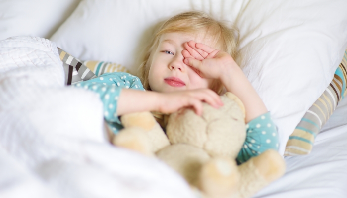 Little girl unable to sleep in bed.