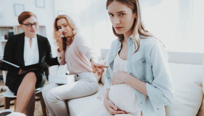 Mother with Pregnant Daughter in Doctor Office.