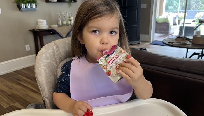 Little girl wearing PandaEar bib.