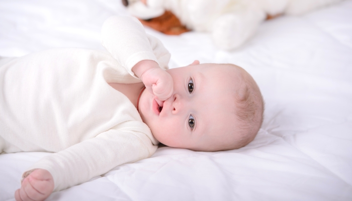 Baby soothing her self in bed.