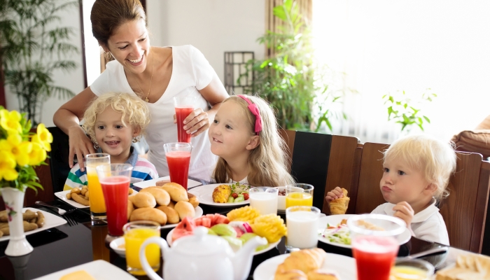 Healthy family breakfast for mother and kids.