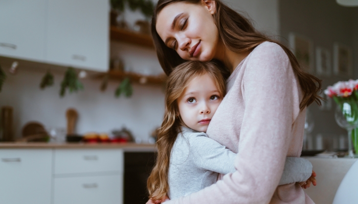 Mom gently hugged her daughter.