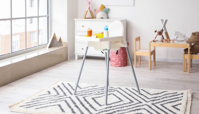 Baby highchair with mat in the room