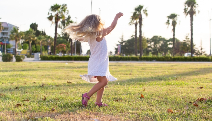 Girl spinning in the street.