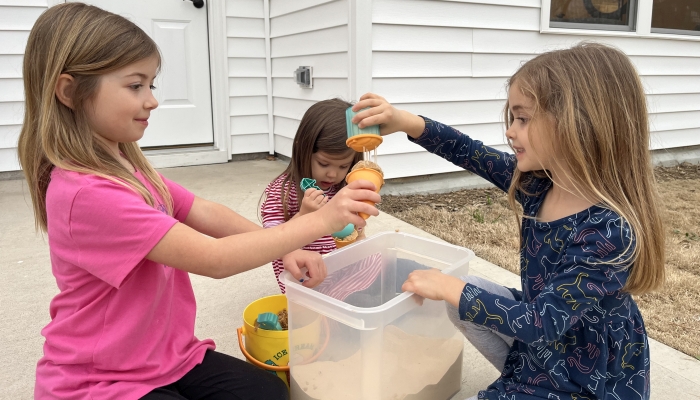 Children enjoying beach toys.