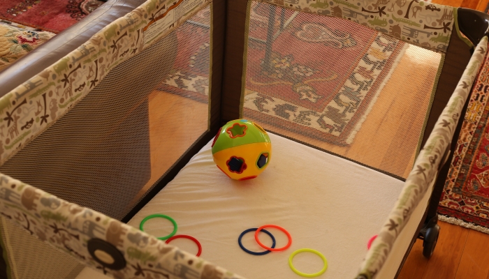 A baby's toys in playpen.