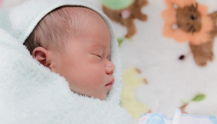 Portrait of Asian newborn baby.