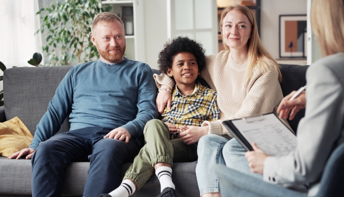 Adoptive family meeting with social worker.