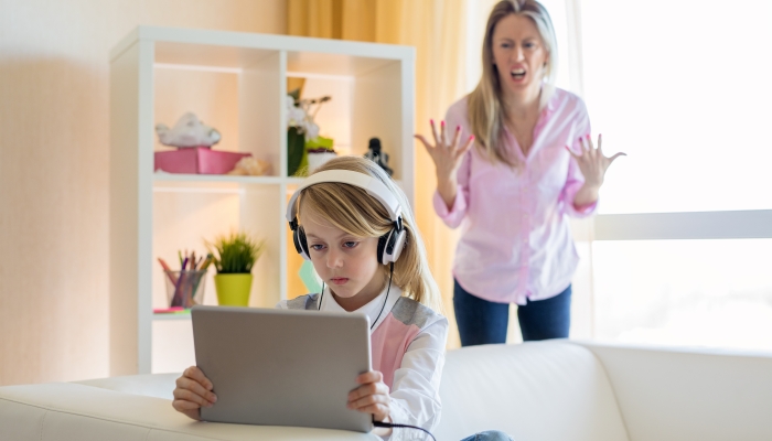 Mom is angry to her gadgets addicted teenage daughter.