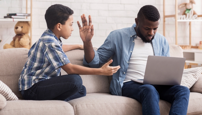 Little Afro Son Asking Attention From His Father.