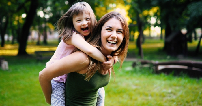 Little girl with special needs enjoy spending time with mother.