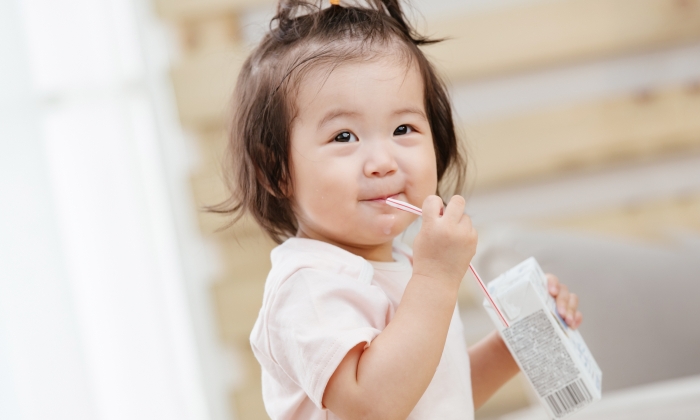 Lovely baby to drink milk.