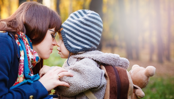 Young Happy Mother Talking to Son.