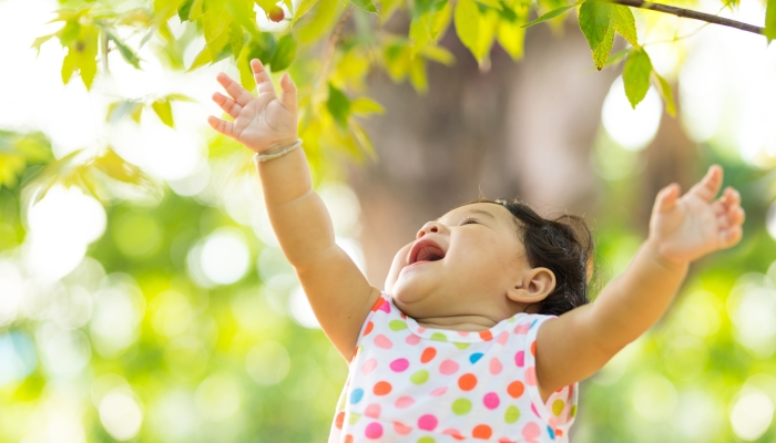 Baby girl harvest red berry happy face.