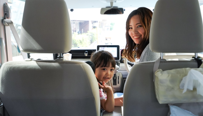 Child and mother driving.