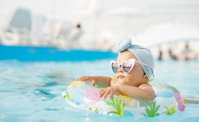 Child having fun in swimming pool.