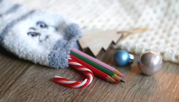 Cute fuzzy sock filled with small presents.