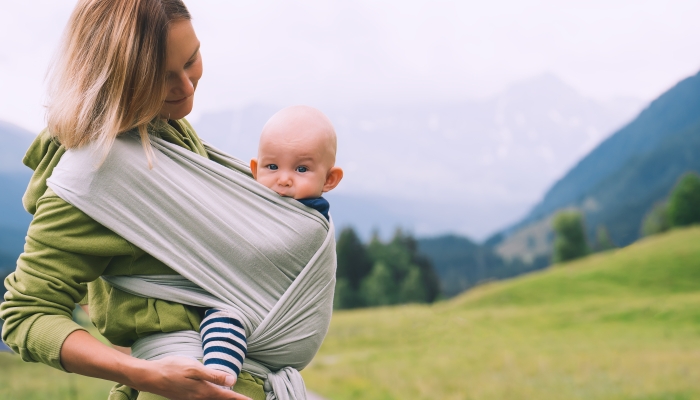 Mother and baby on nature outdoors.