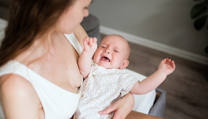 Newborn crying boy.