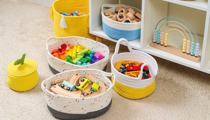 Nursery room with shelves and colourful storage baskets.