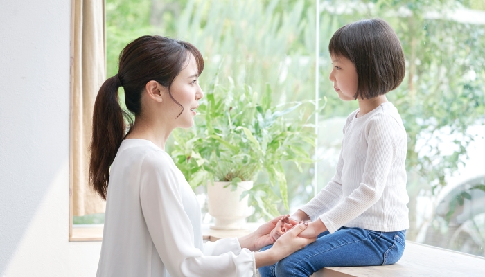 Asian mother talking with the daughter.