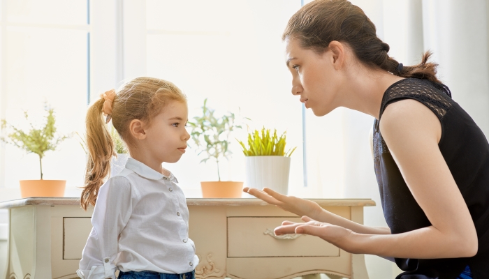 Mother scolds her child.