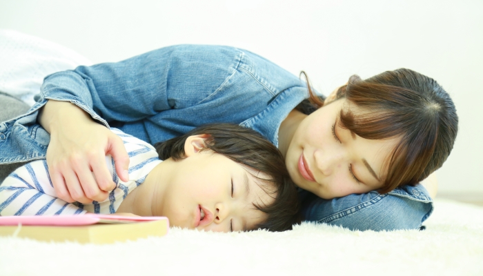 Parent and child taking a nap.