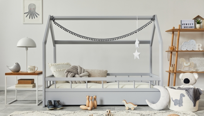 Stylish scandinavian child's room with creative wooden bed.