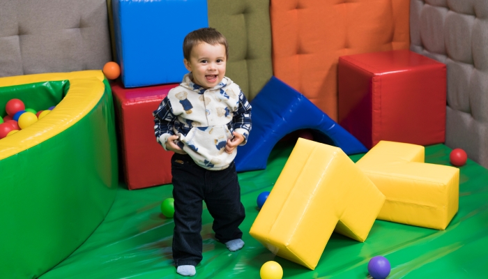 Little boy 1 year playing in the kindergarten.