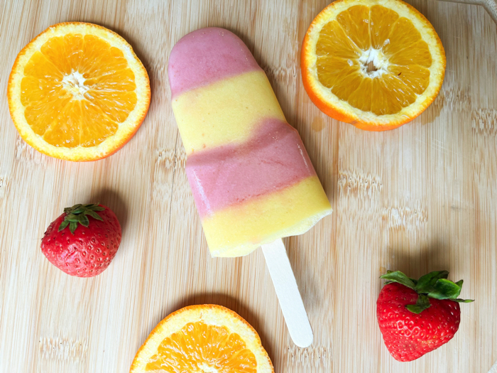 Strawberry orange coconut popsicles.