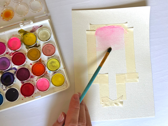 Paint inside the tape to make your watercolor popsicle painting.