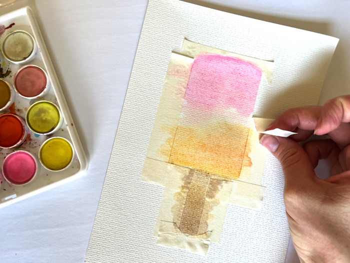 Remove tape to reveal the shape of your watercolor popsicle painting.