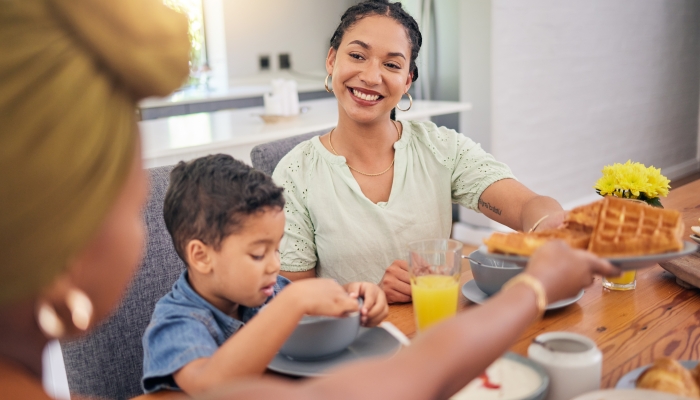 Breakfast food and family eating meal.